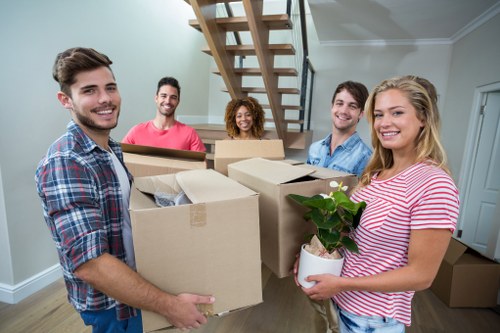 Professional furniture movers transporting items in Pimlico