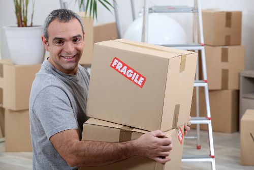 Removal team sorting recyclable packing materials during a Pimlico house move