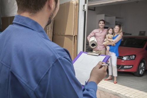 Pimlico removals staff handling packed boxes with care