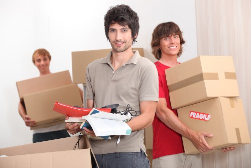 Flat removals in Pimlico with movers preparing boxes