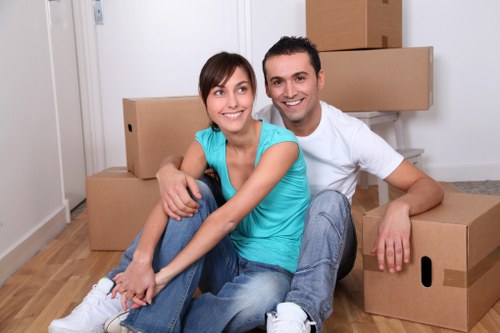 Movers managing furniture with care during a property relocation