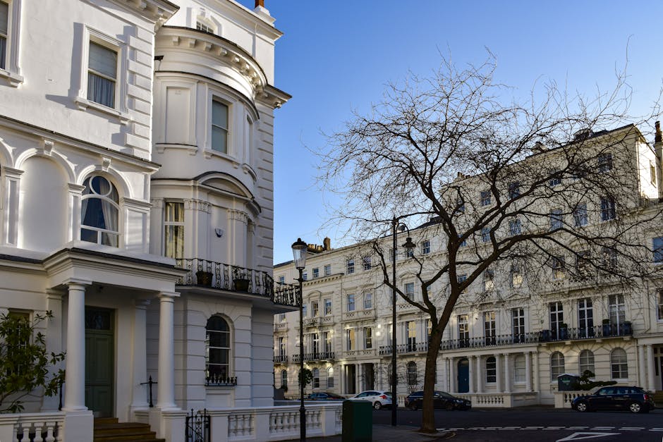A close-up view of a building exterior in Westminster, displaying a white street sign with black and red text indicating 'BELL YARD WC2' in the City of Westminster. Below the sign, there is a small se